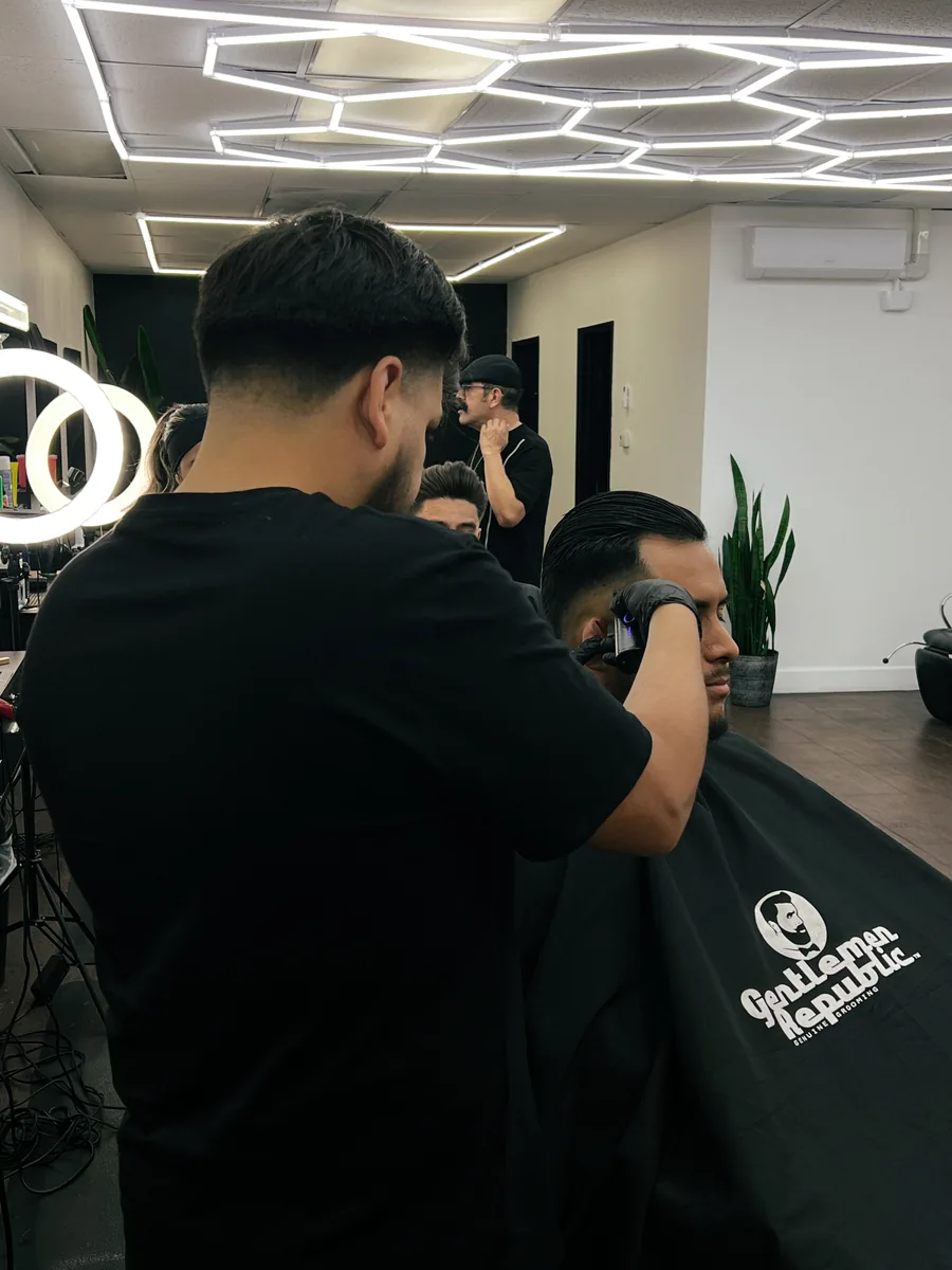 Barbershop floor with clients getting fresh cuts