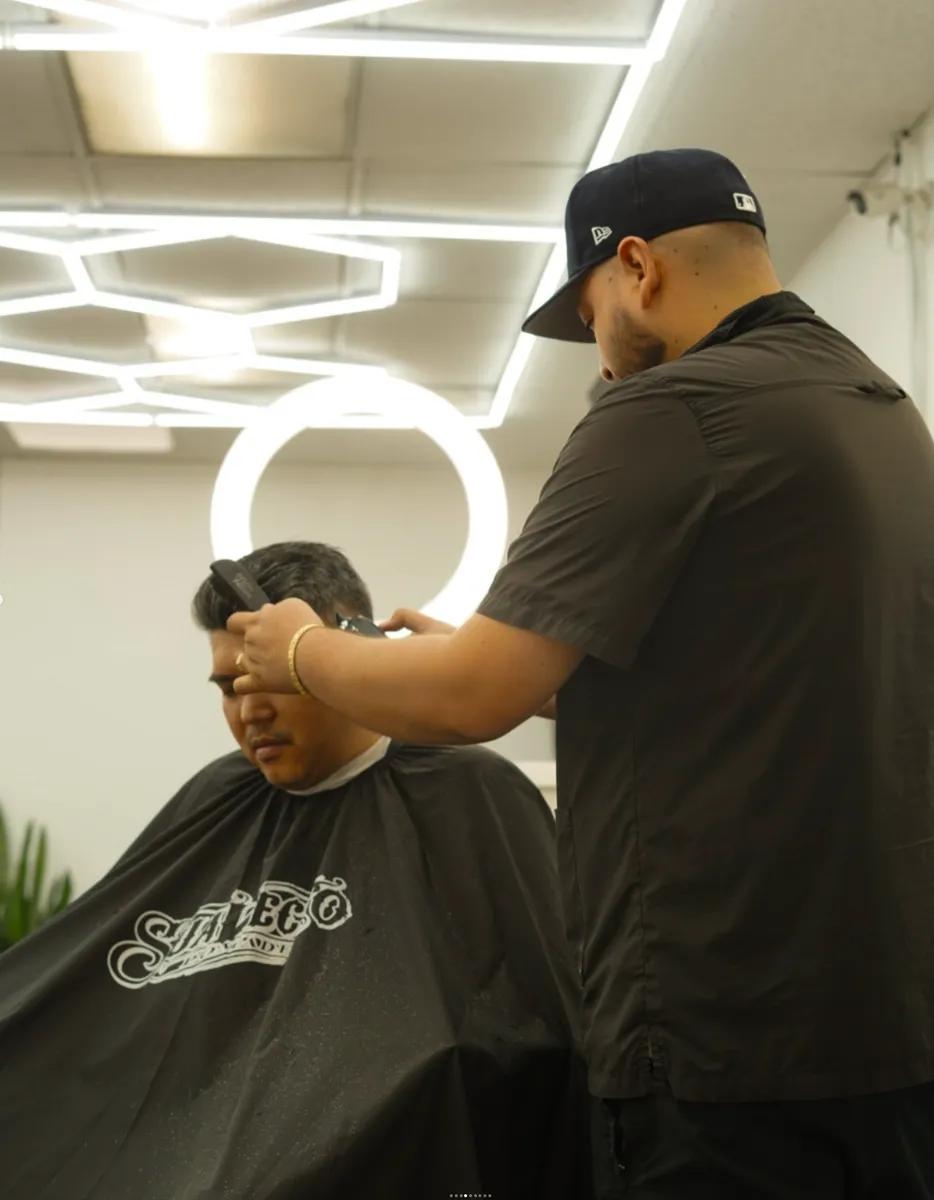 Barber cutting hair